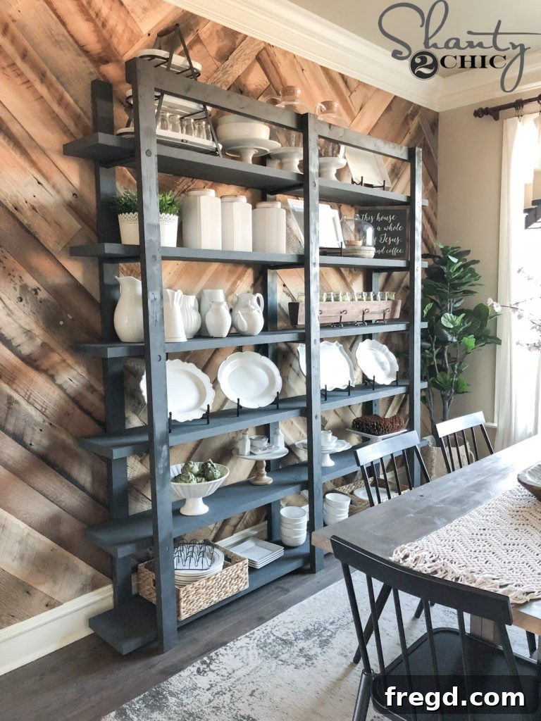 Craft Your Own Modern Farmhouse Dish Display 25 Full view of the DIY Modern Farmhouse Plate Rack with plates and decor in a dining room