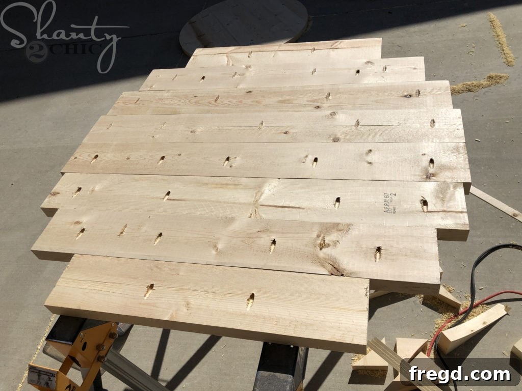 Joining wood planks with pocket hole screws and wood glue for a smooth table surface