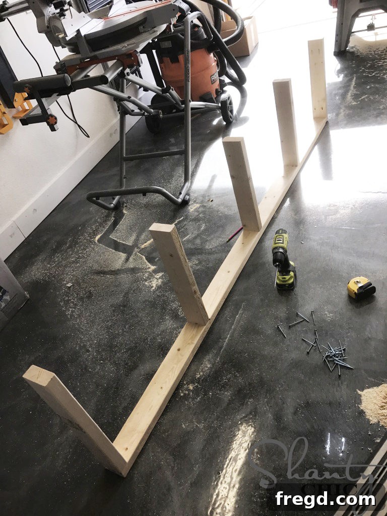 Attaching First Long Frame Piece to DIY Lumber Cart Base