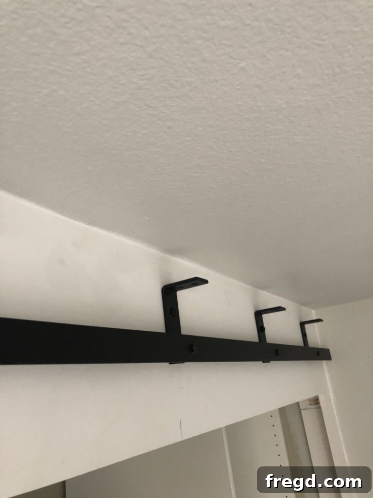 All five brackets and first track installed