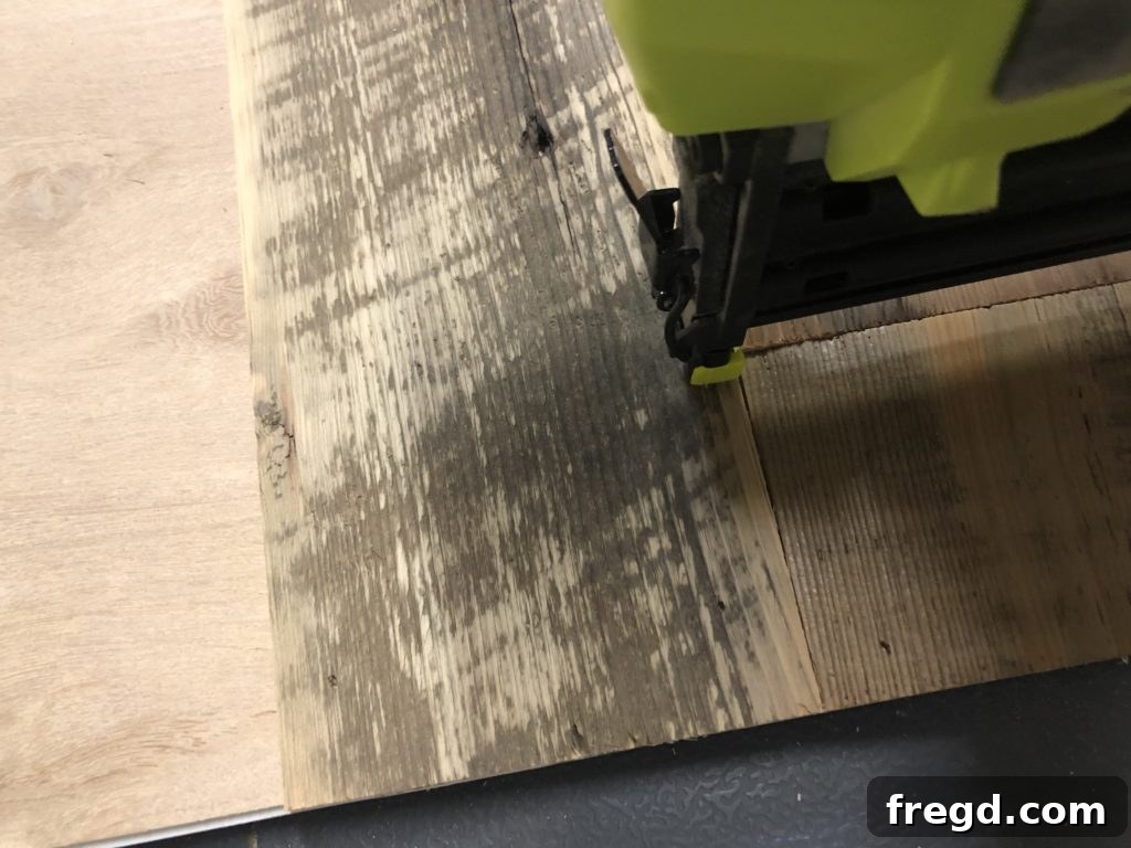 Securing barn wood planks with glue and brad nails