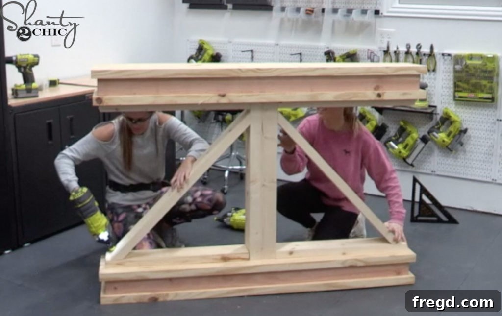 Angled truss pieces are meticulously measured, cut, and then attached to the table base with finish nails and wood glue, completing the decorative truss design.