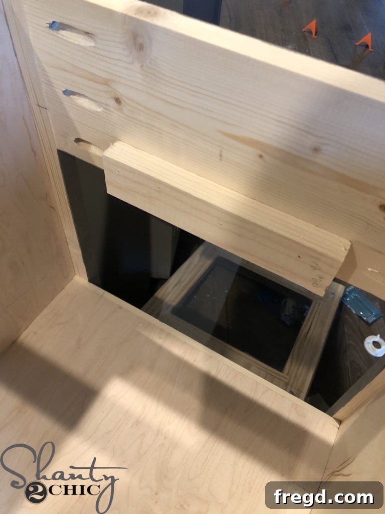 Attaching the oven door catch block to the face frame
