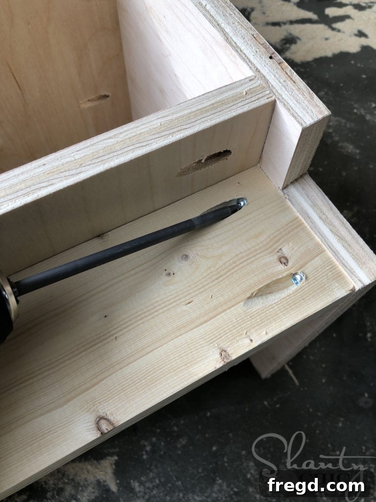 Attaching the refrigerator base frame piece