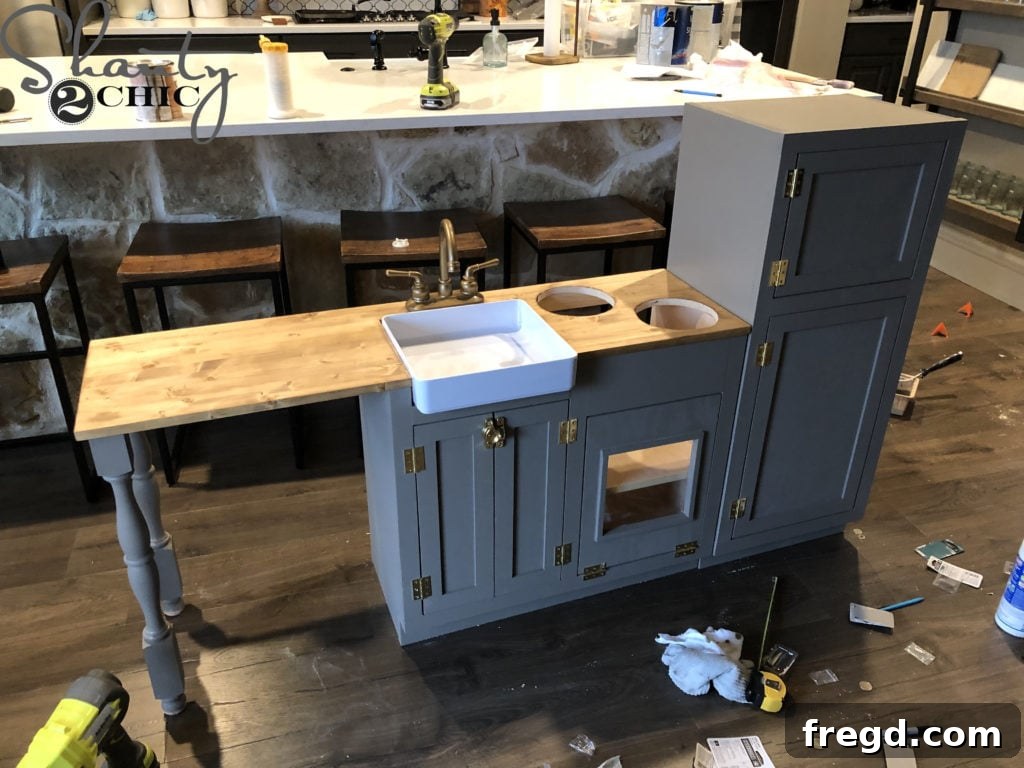 Staining the countertop and painting the play kitchen