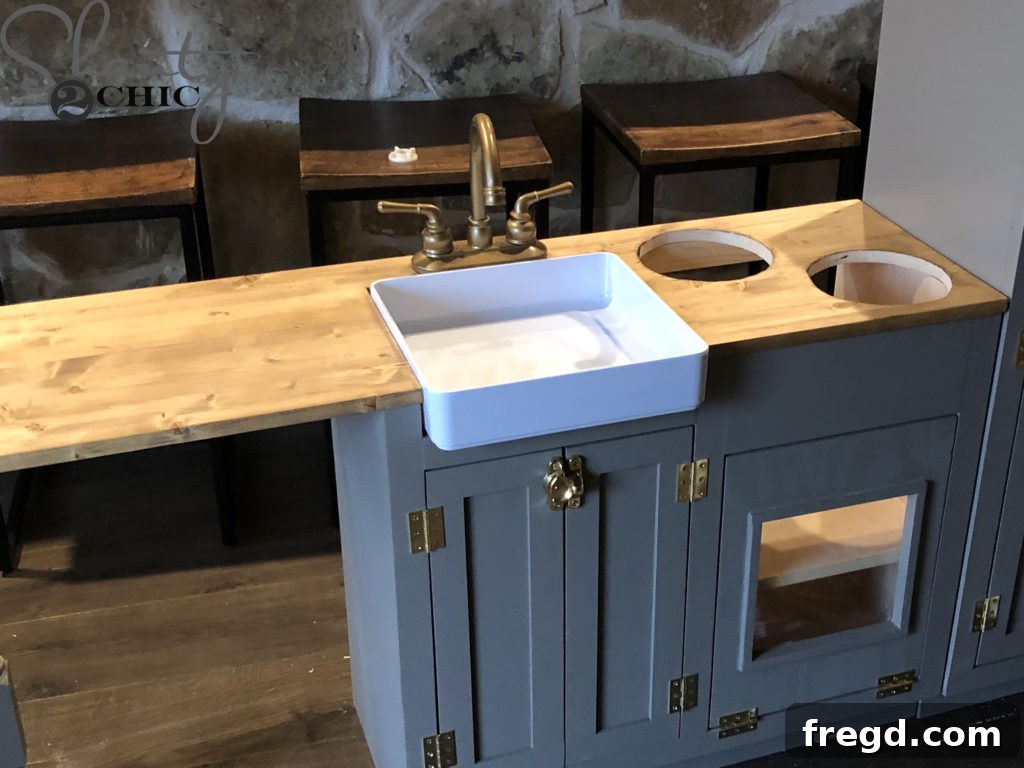Securing the play kitchen faucet in place