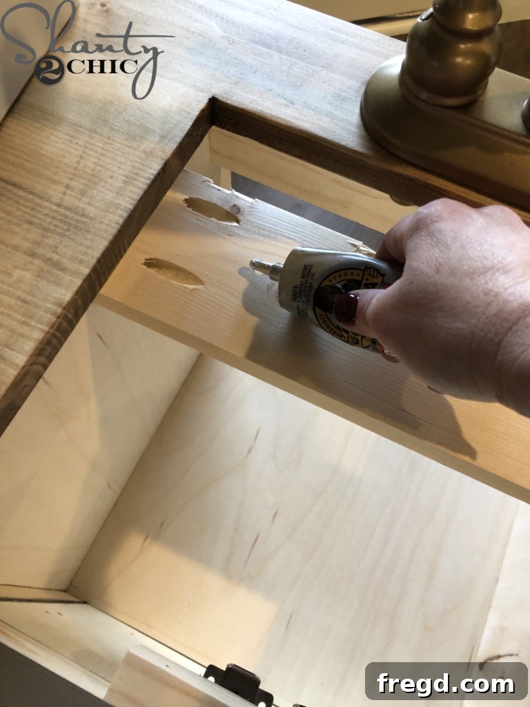 Installing the realistic farmhouse sink into the countertop