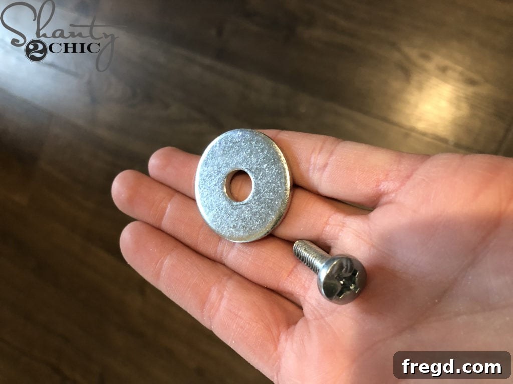 Securing the turning play kitchen knobs with screws and washers