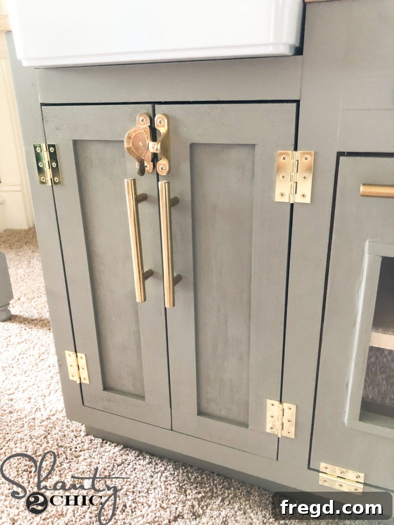 Attaching cabinet pulls and hinges to all play kitchen doors