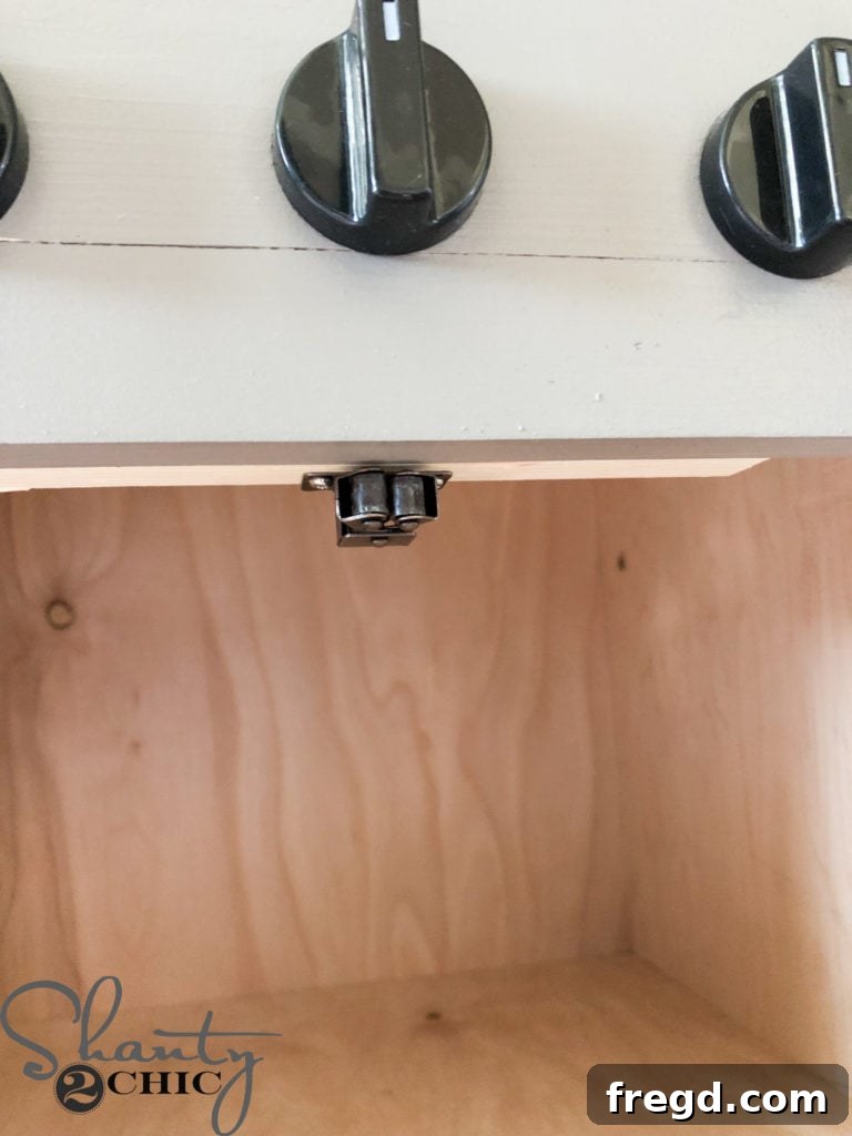 Attaching the receiving end of the oven door catch