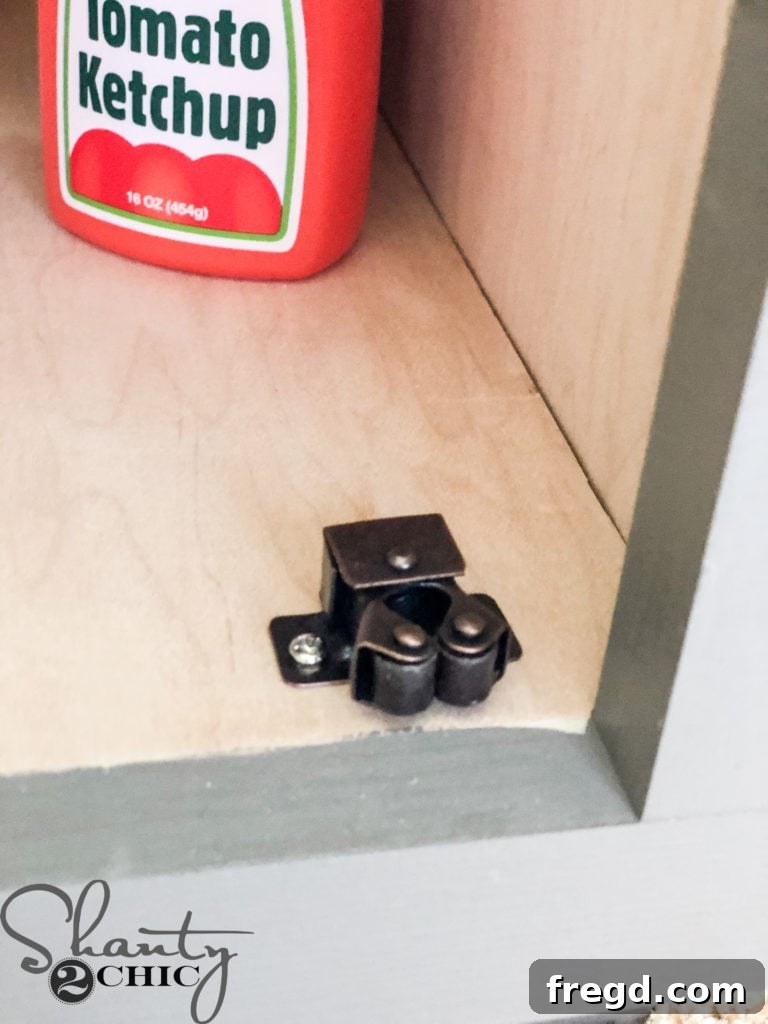 Installing door catches on sink and refrigerator doors