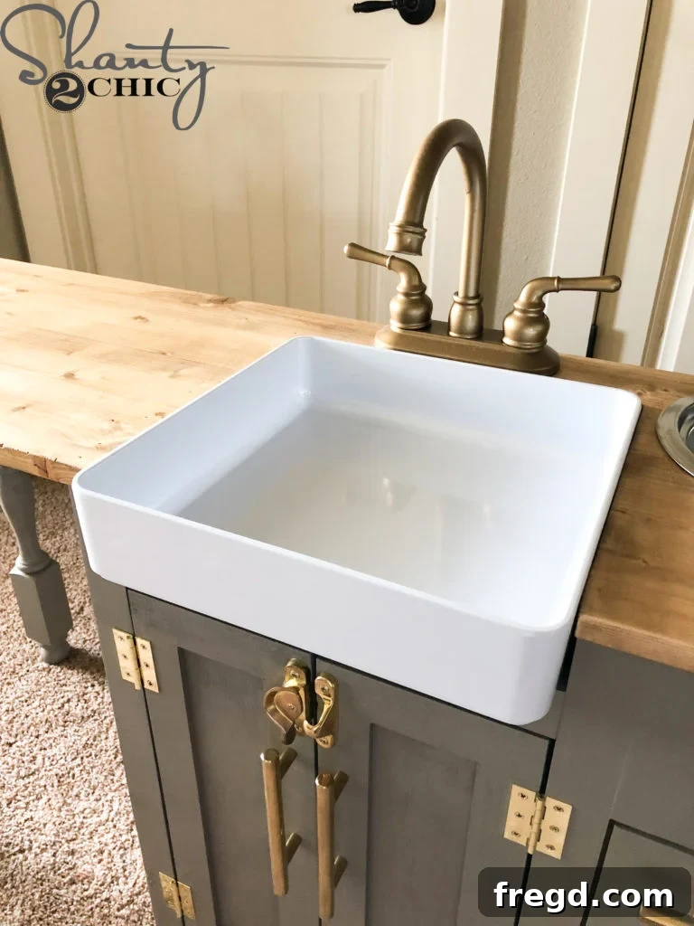 Close-up of the realistic farmhouse sink in the play kitchen