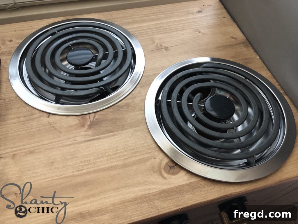 Child enjoying the realistic stove burners on the play kitchen