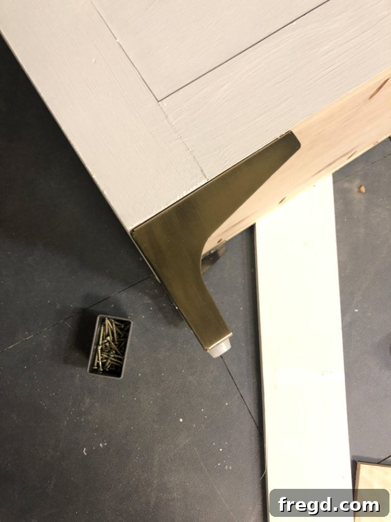 Stylish dresser feet adding a touch of glam to the base