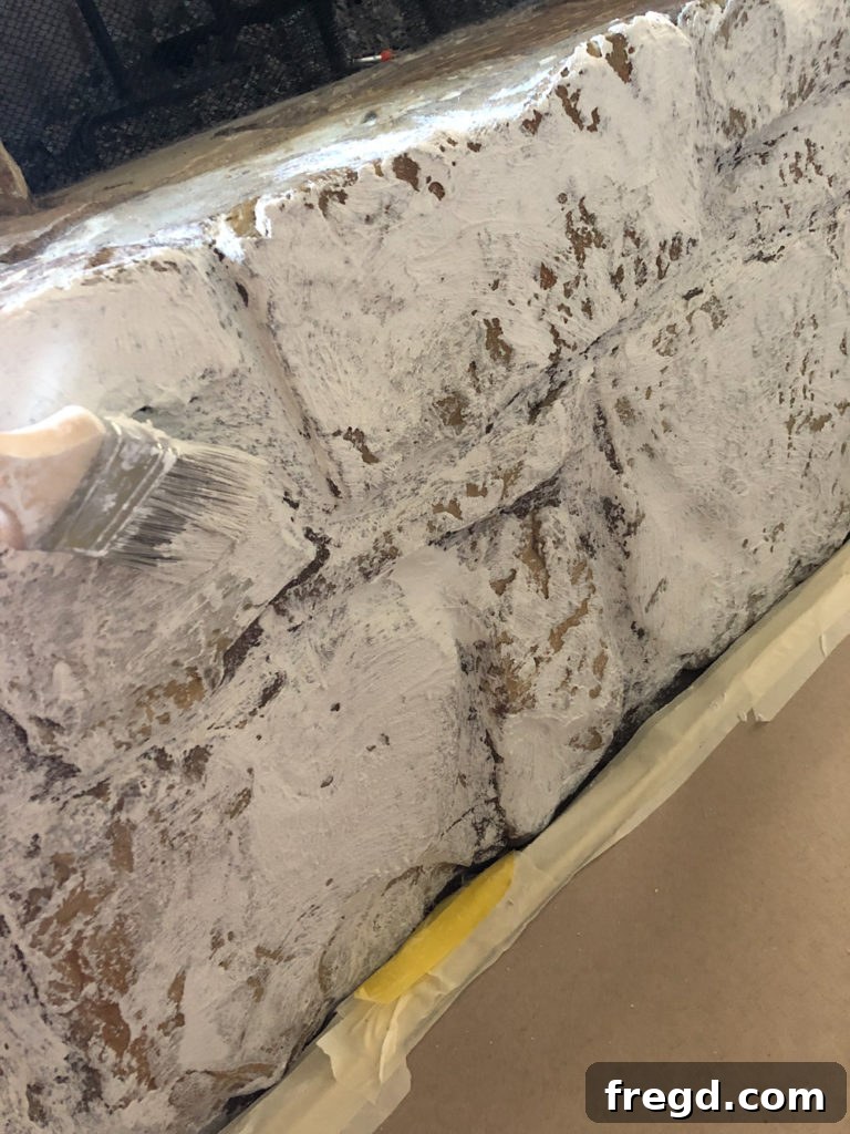 Mid-process view of fireplace transformation