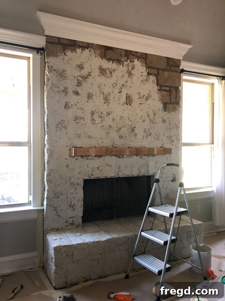 Working on the upper sections of the stone fireplace