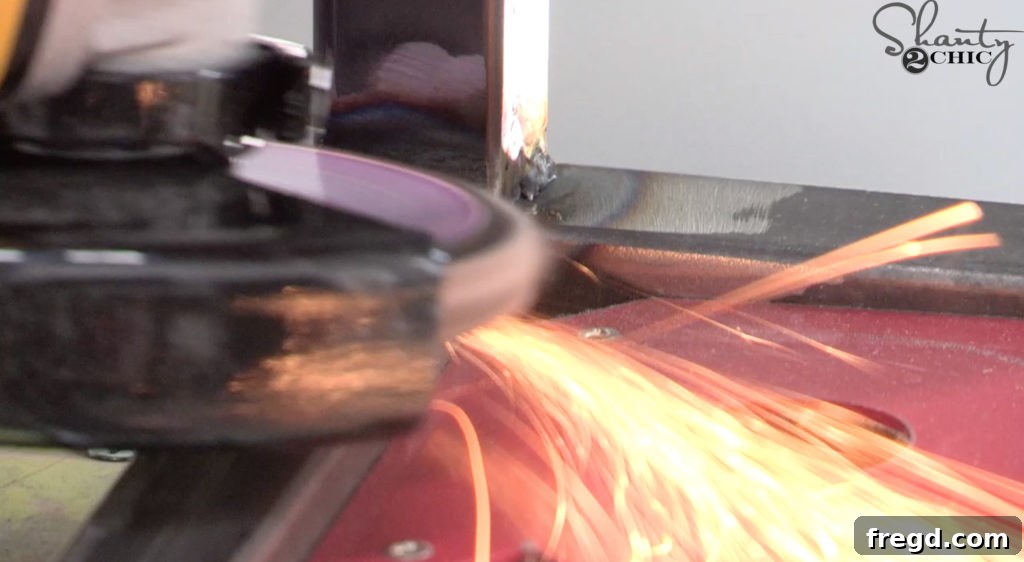 Grinding down the welds on the metal base