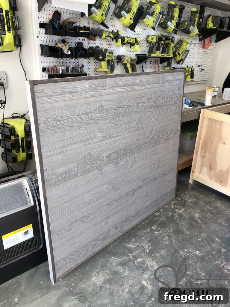 Attaching the side trim pieces to the DIY barn door frame