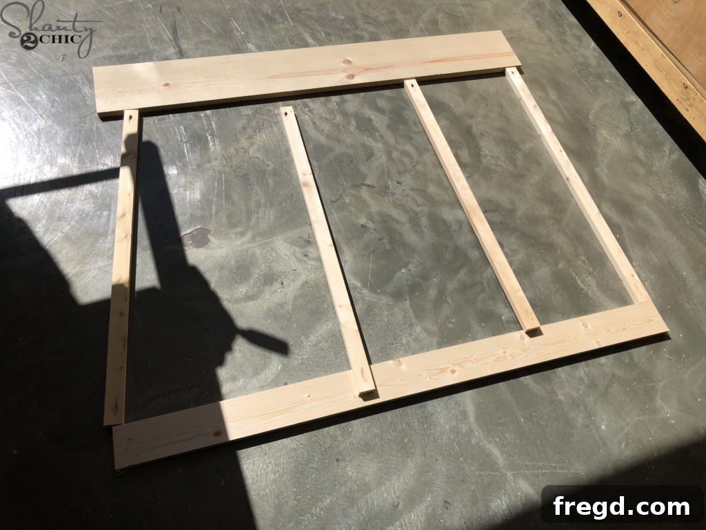 Barn door frame pieces cut and ready for assembly with pocket holes visible