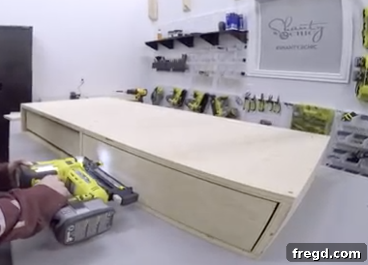 The final step of adding the drawer faces to complete the coffee table's look.