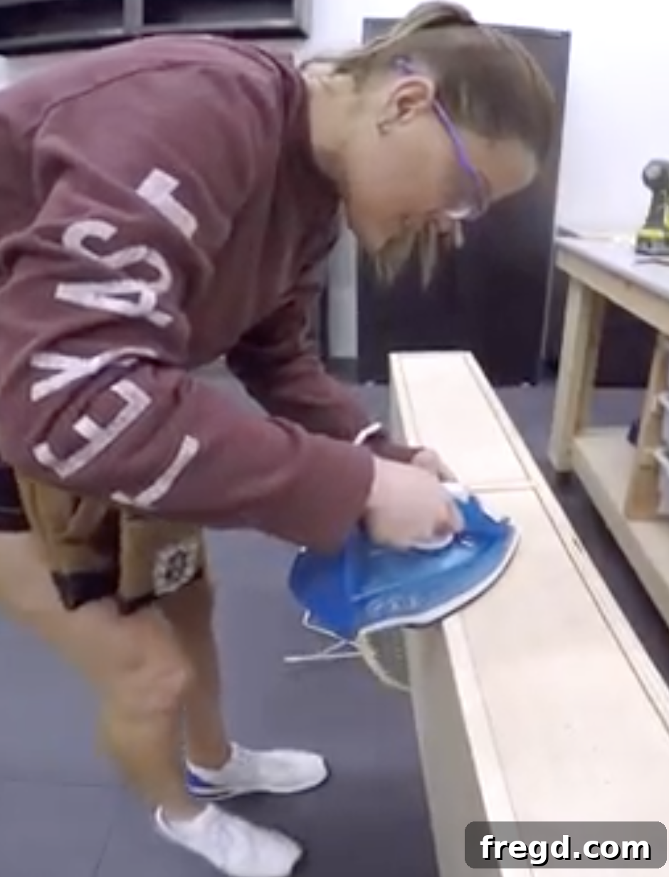 Applying edge banding to the plywood edges for a clean, finished appearance.
