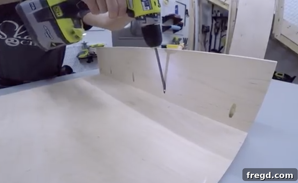 Step-by-step assembly: Attaching the side panels of the coffee table frame using pocket holes and wood glue.