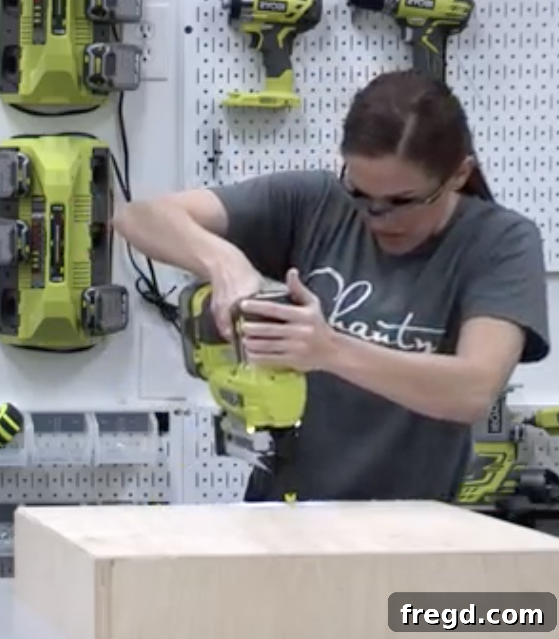 Attaching the 1/4 inch plywood bases to the drawer boxes with glue and a nailer.