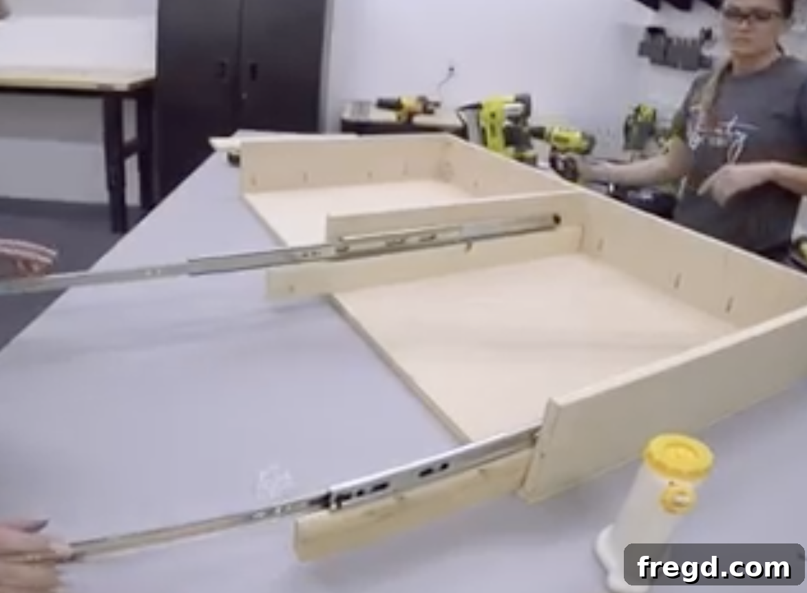 Installation of drawer slides within the coffee table frame, crucial for smooth drawer movement.