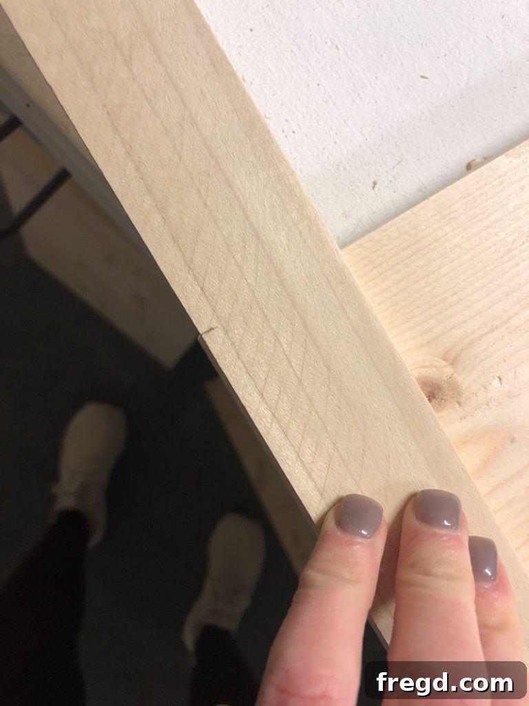 Measuring and cutting vertical trim for wood frame