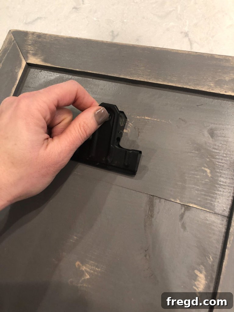 Distressing the finished wood frame