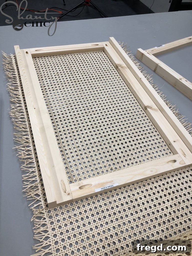 Measuring and cutting cane webbing to fit the frames.