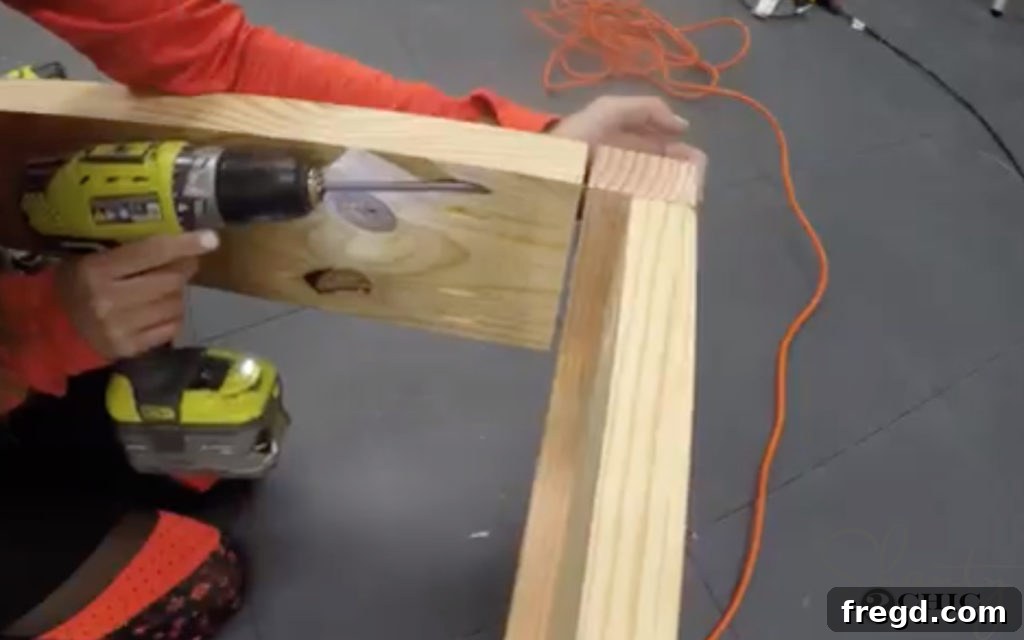 Attaching side rails to the headboard and footboard with pocket hole screws.