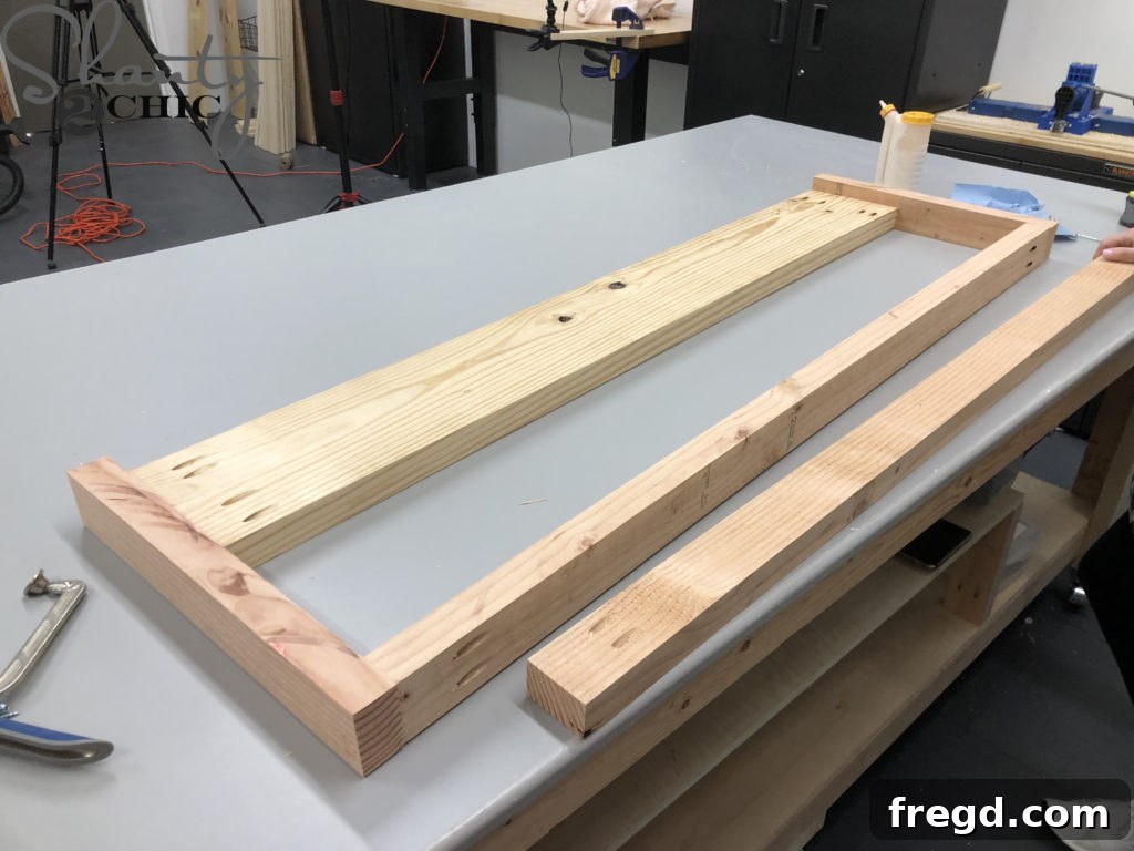 Assembling footboard components with wood glue and pocket hole screws.
