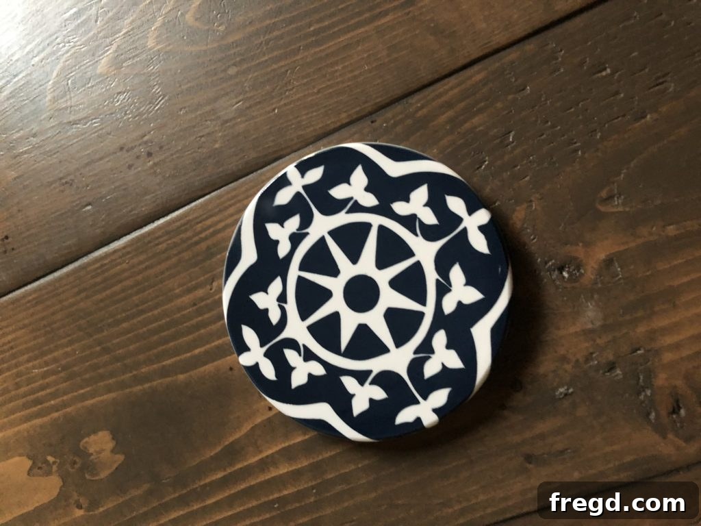 Infusible Ink Prepare To Be Amazed 9 Revealing the vibrant Infusible Ink design on a cooled ceramic coaster