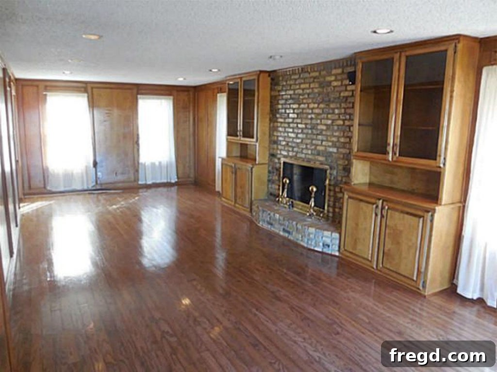 Before shot of the flip house living room, revealing its enclosed nature