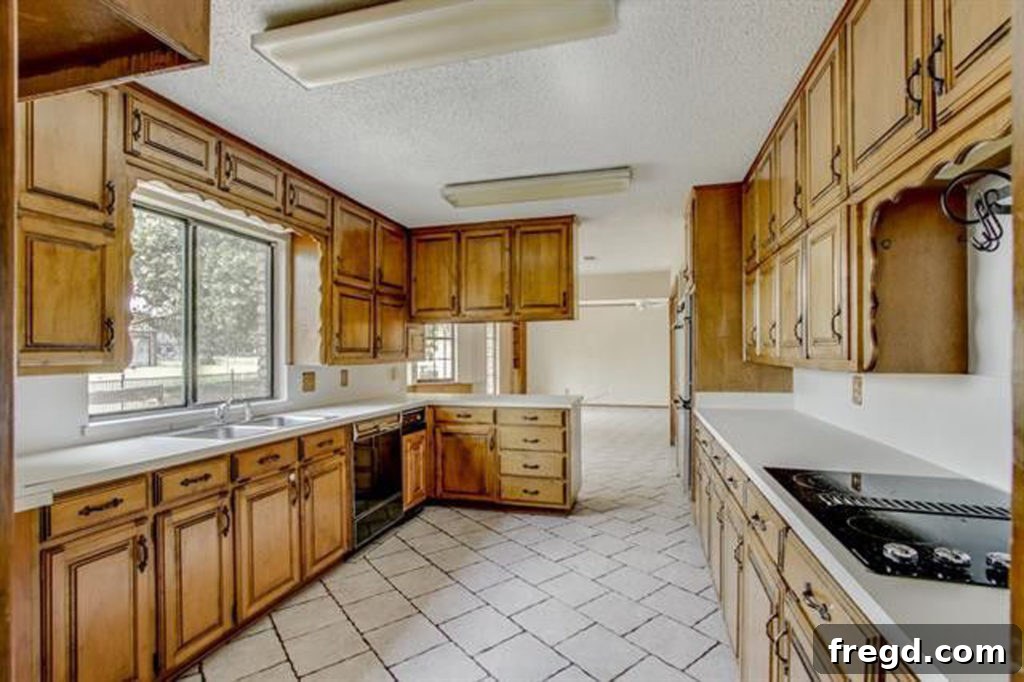 Original galley kitchen in the flip house, with a window overlooking the pasture