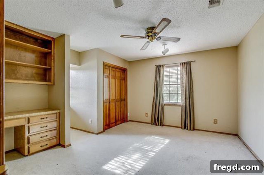 Flip house front upstairs secondary bedroom, positioned above the living room