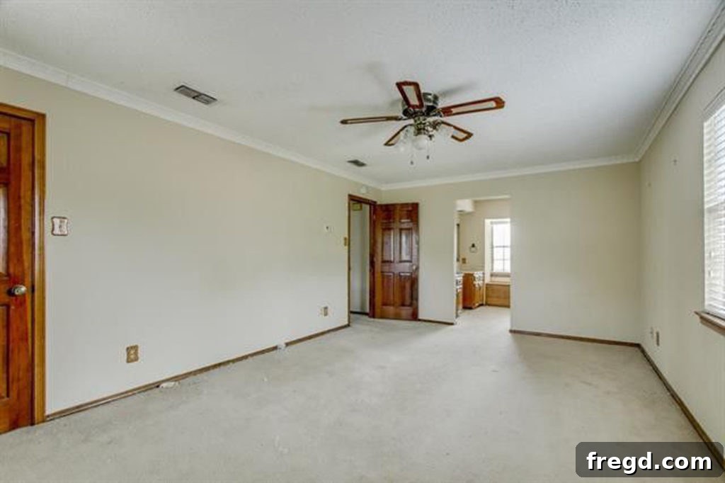 Upstairs original master bedroom, featuring ample natural light