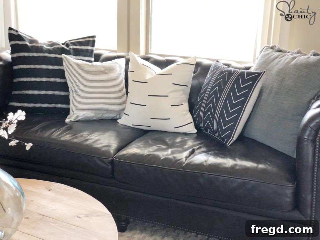 Assortment of stylish pillow covers on a couch