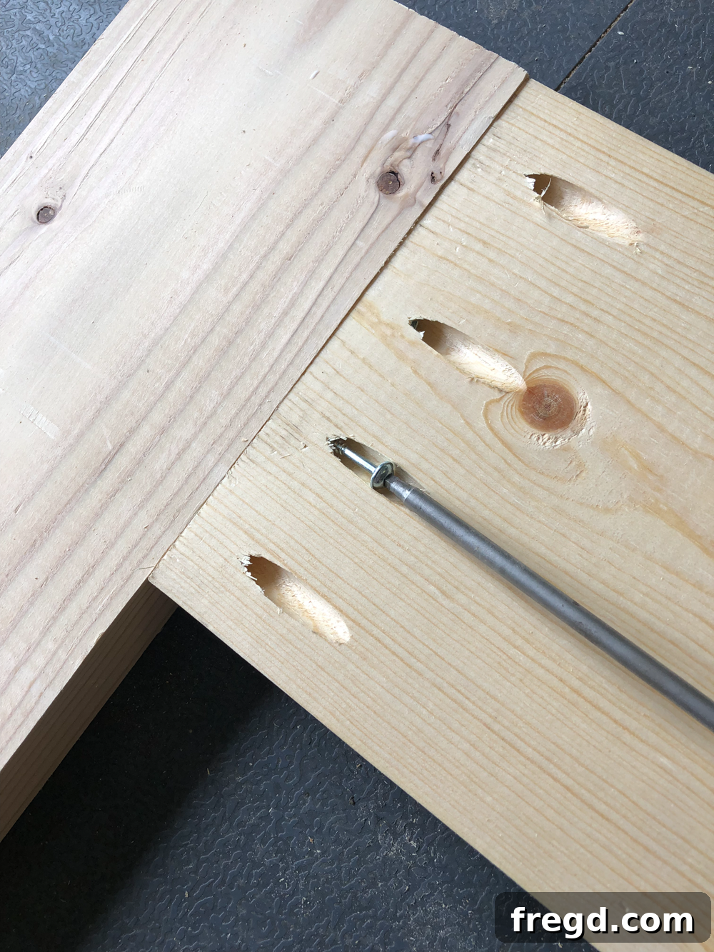 Build Your Own Faux Drawer Console Table 13 Attaching an apron to a leg using pocket hole screws, ensuring flush alignment.