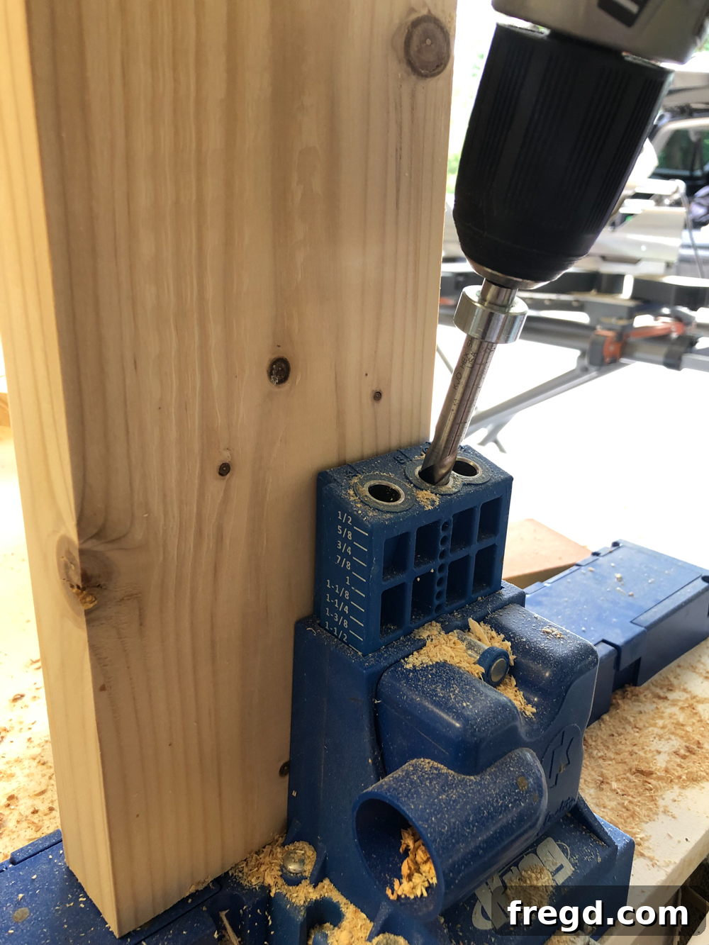 Build Your Own Faux Drawer Console Table 16 Drilling 1.5 inch pocket holes into shelf supports using a Kreg K5 jig.