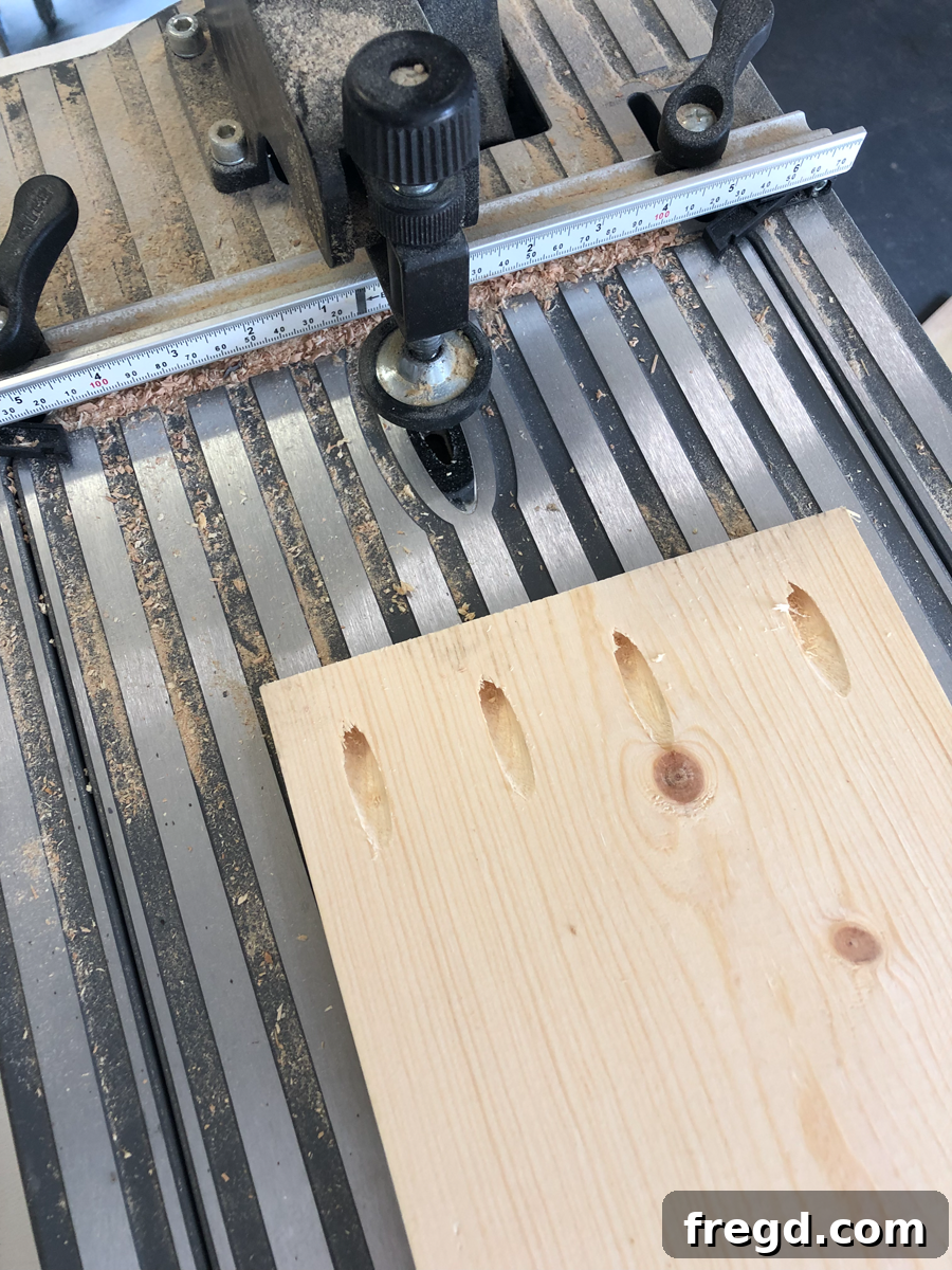 Build Your Own Faux Drawer Console Table 3 Close-up of pocket holes precisely drilled into a wooden apron piece.