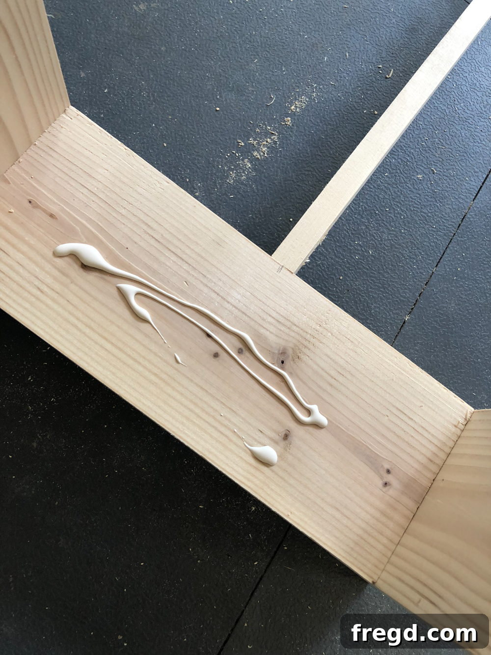 Build Your Own Faux Drawer Console Table 26 Carefully placing the laminated pine project panel for the bottom shelf onto its supports.