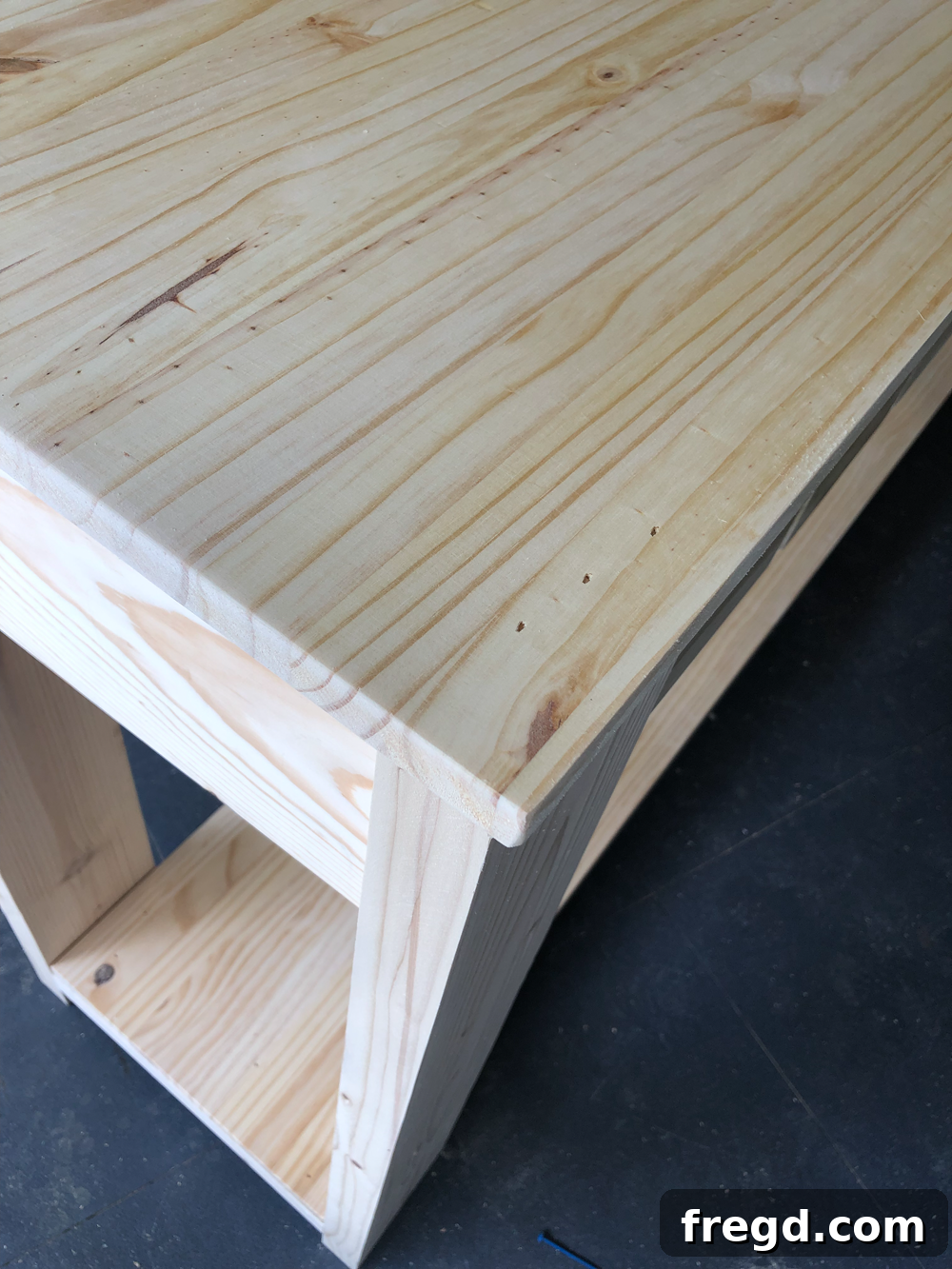 Build Your Own Faux Drawer Console Table 29 Attaching the tabletop to the console table base, ensuring perfect alignment.
