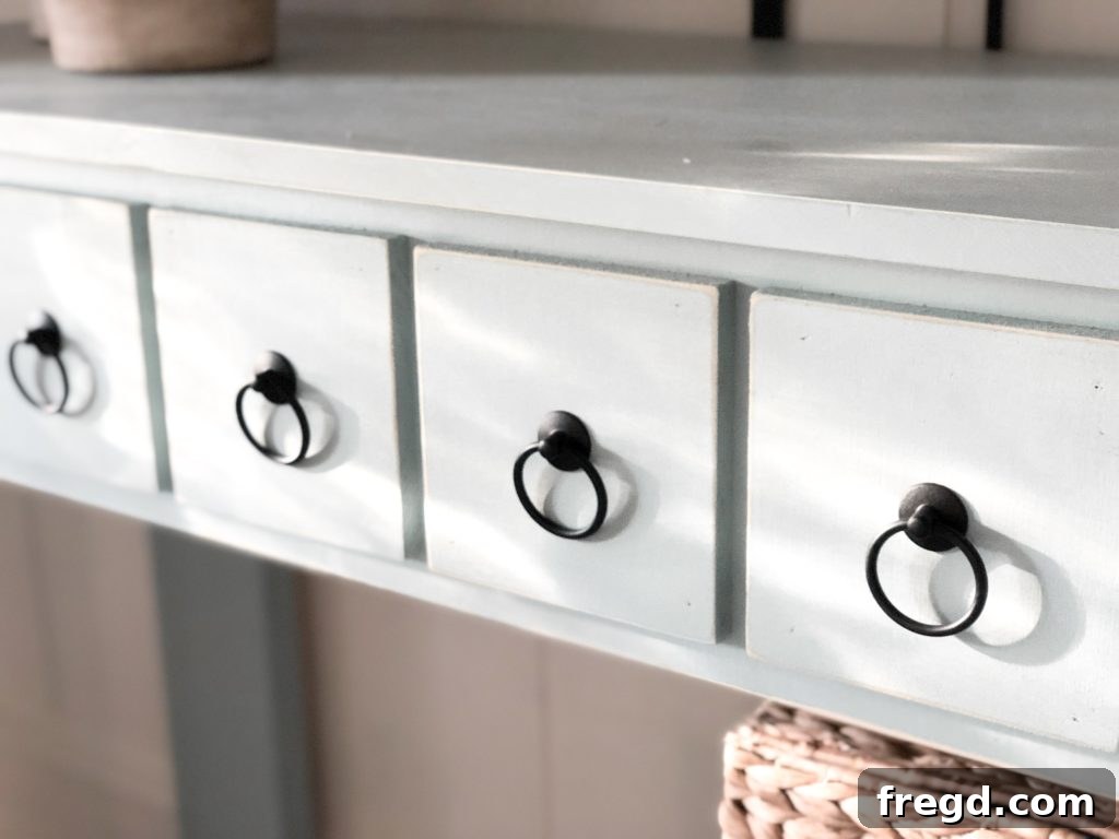 Detailed shot of the ring pulls on the faux drawer fronts of the console