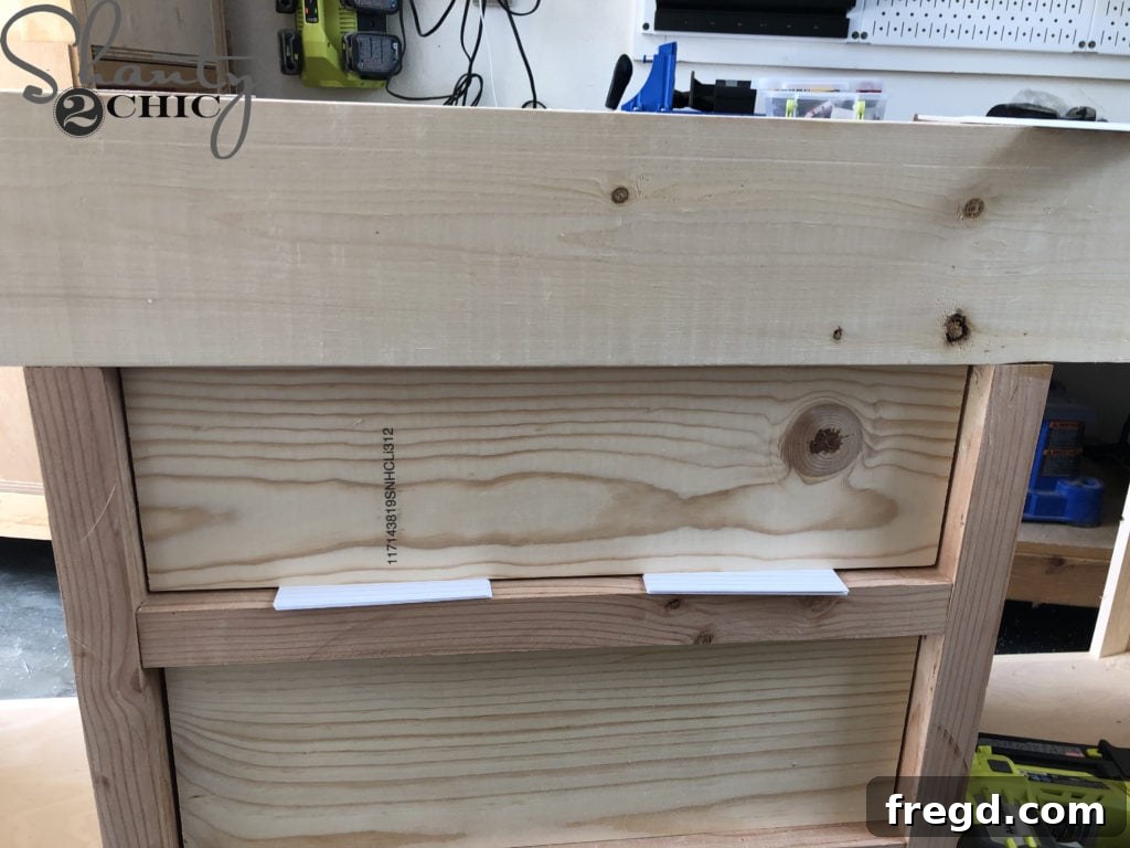 DIY Rustic Double Sink Bathroom Vanity with Barn Door Storage 24 Use spacers to attach the drawer faces