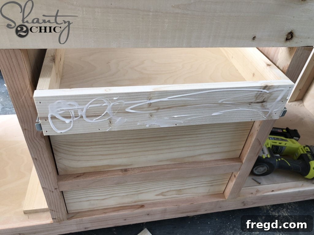 DIY Rustic Double Sink Bathroom Vanity with Barn Door Storage 25 Wood glue on drawer face
