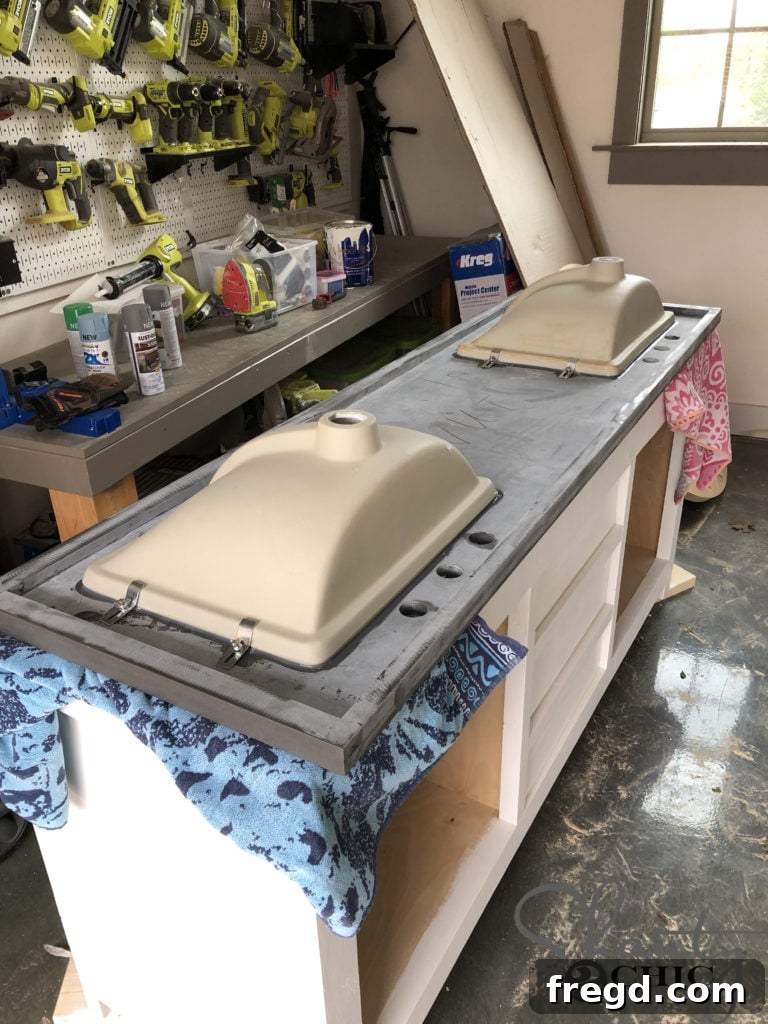 DIY Rustic Double Sink Bathroom Vanity with Barn Door Storage 44 Installing the sinks to the countertop for the DIY Vanity