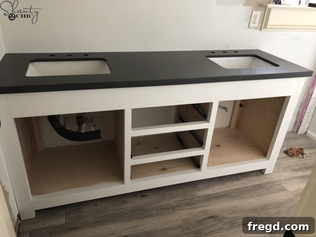 DIY Rustic Double Sink Bathroom Vanity with Barn Door Storage 51 Quartz countertop installed on DIY Vanity
