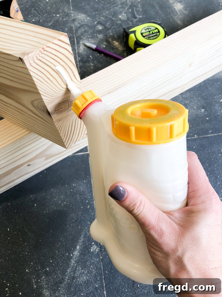 Sawhorse Chic: A DIY Modern Farmhouse Dining Table 11 Finished sawhorse table leg assembly, showing the angled legs and top runner